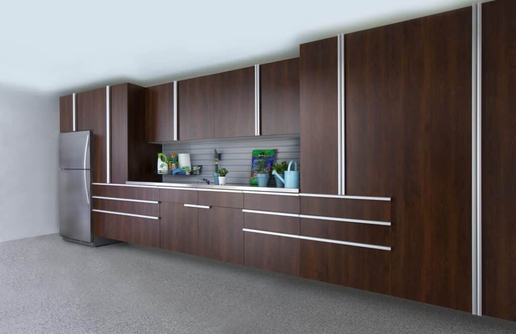 Image of a fully finished Coco-Cabinets-Stainless-Workbench-Gray-Slatwall-Smoke-Floor-Angle-Sep-2013