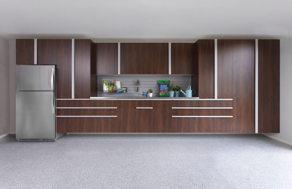 Image of a fully finished Coco-Cabinets-Stainless-Workbench-Gray-Slatwall-Smoke-Floor-Sep-2013