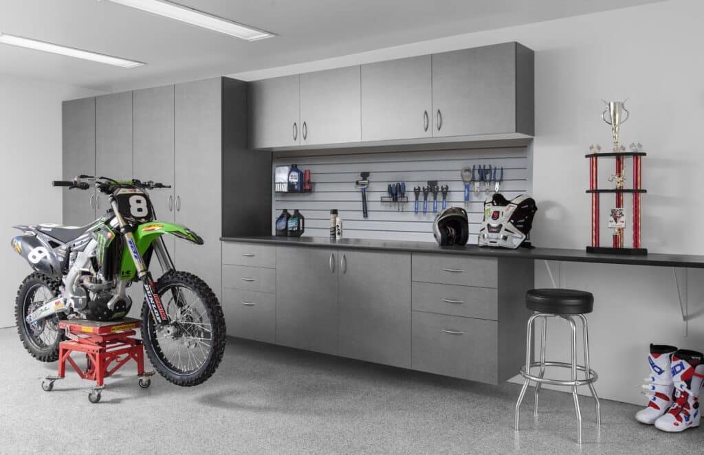 Image of a fully finished Pewter-Cabinets-Ebony-Star-Workbench-SLATWALL-Silverado-Floor-Dirt-Bike-Abbott-May-2013
