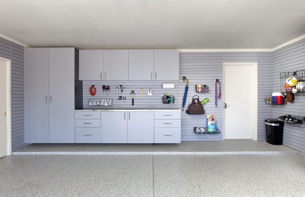 Image of a fully finished Silver-Cabinets-Stainless-Counter-Grey-Slatwall-Barker-2012