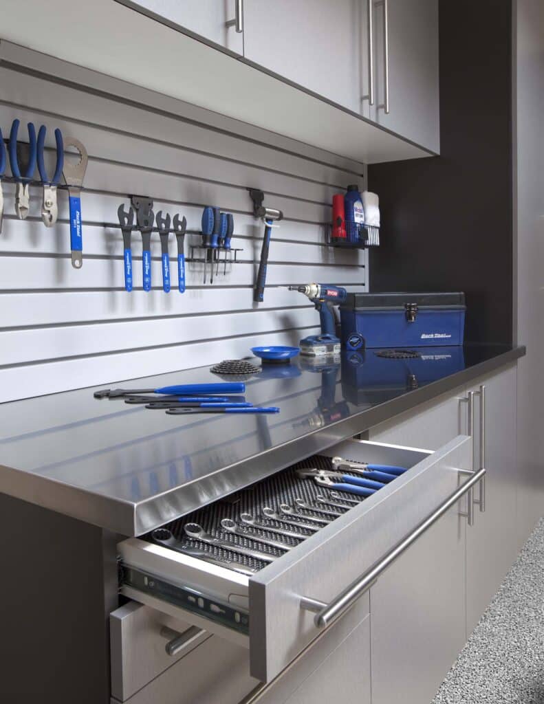 Image of a fully finished Silver-Cabinets-Stainless-Workbench-Drawer-Open-Gray-Slatwall-Feb-2013