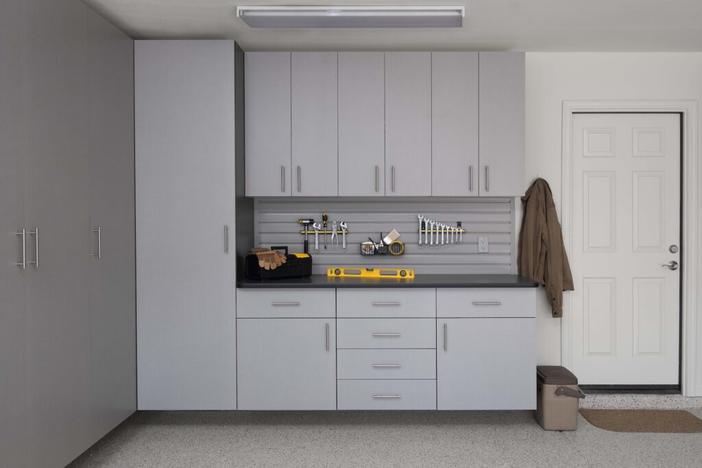 Image of a fully finished Silver-Cabinets-with-Ebony-Star-Workbench-Gray-Slatwall-Malouf-2016